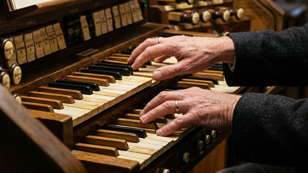 Picture of a woman standing at a podium giving a talk